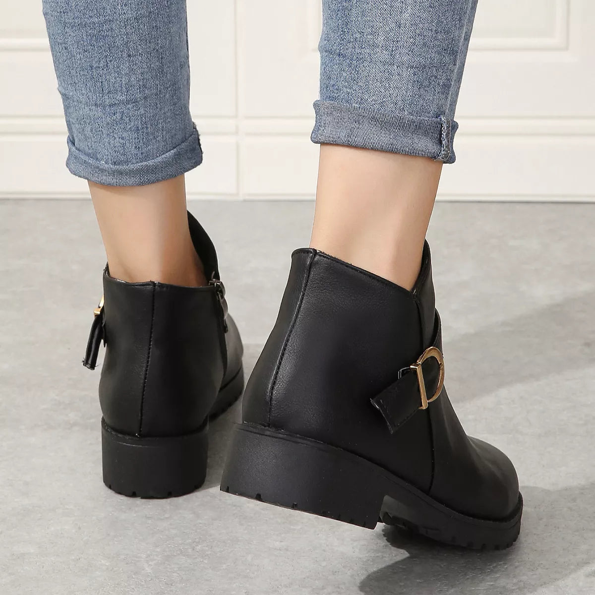 Buckle accent ankle boots close up of the toe