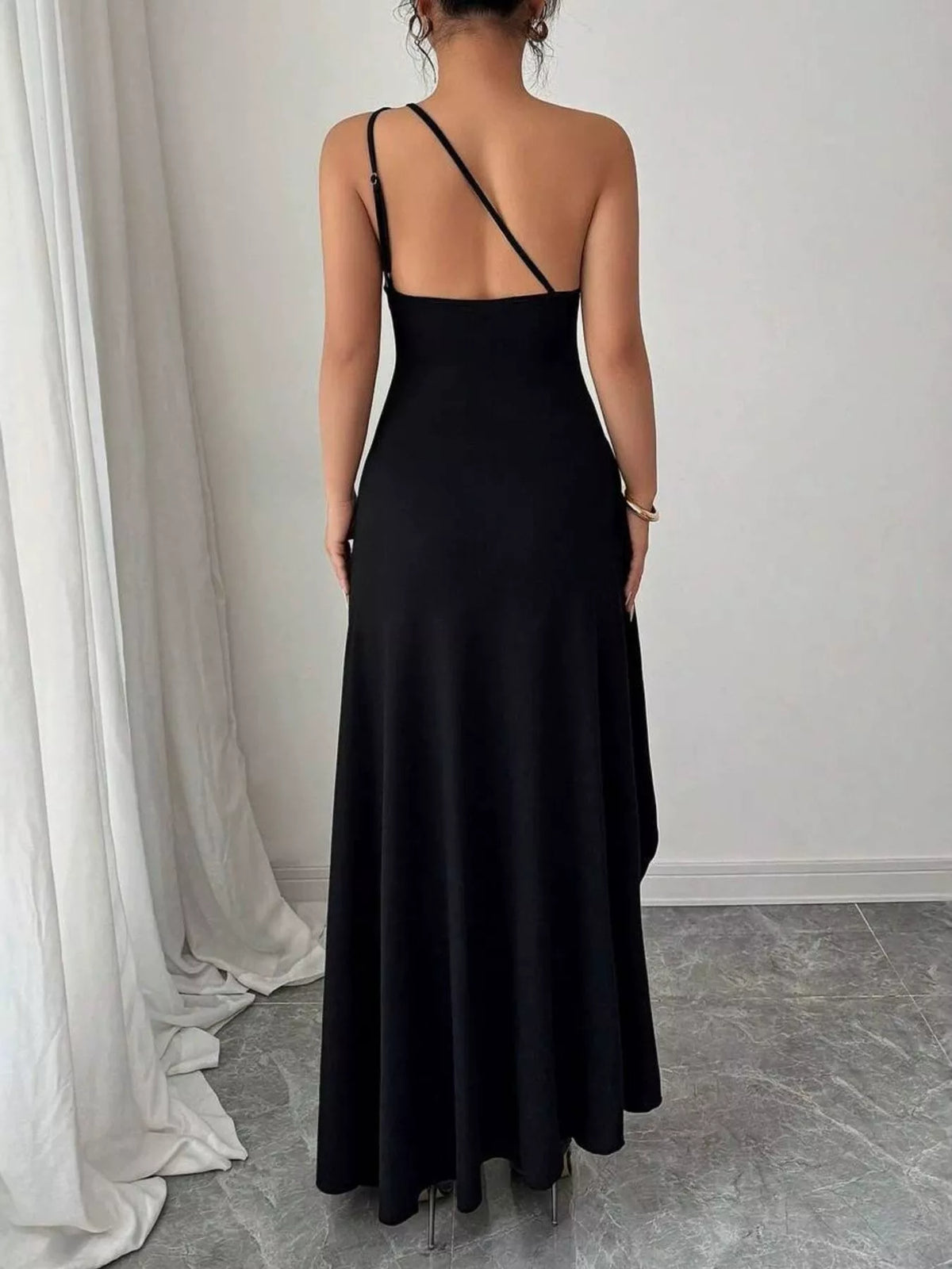 Close view of the one shoulder neckline and ruched detail