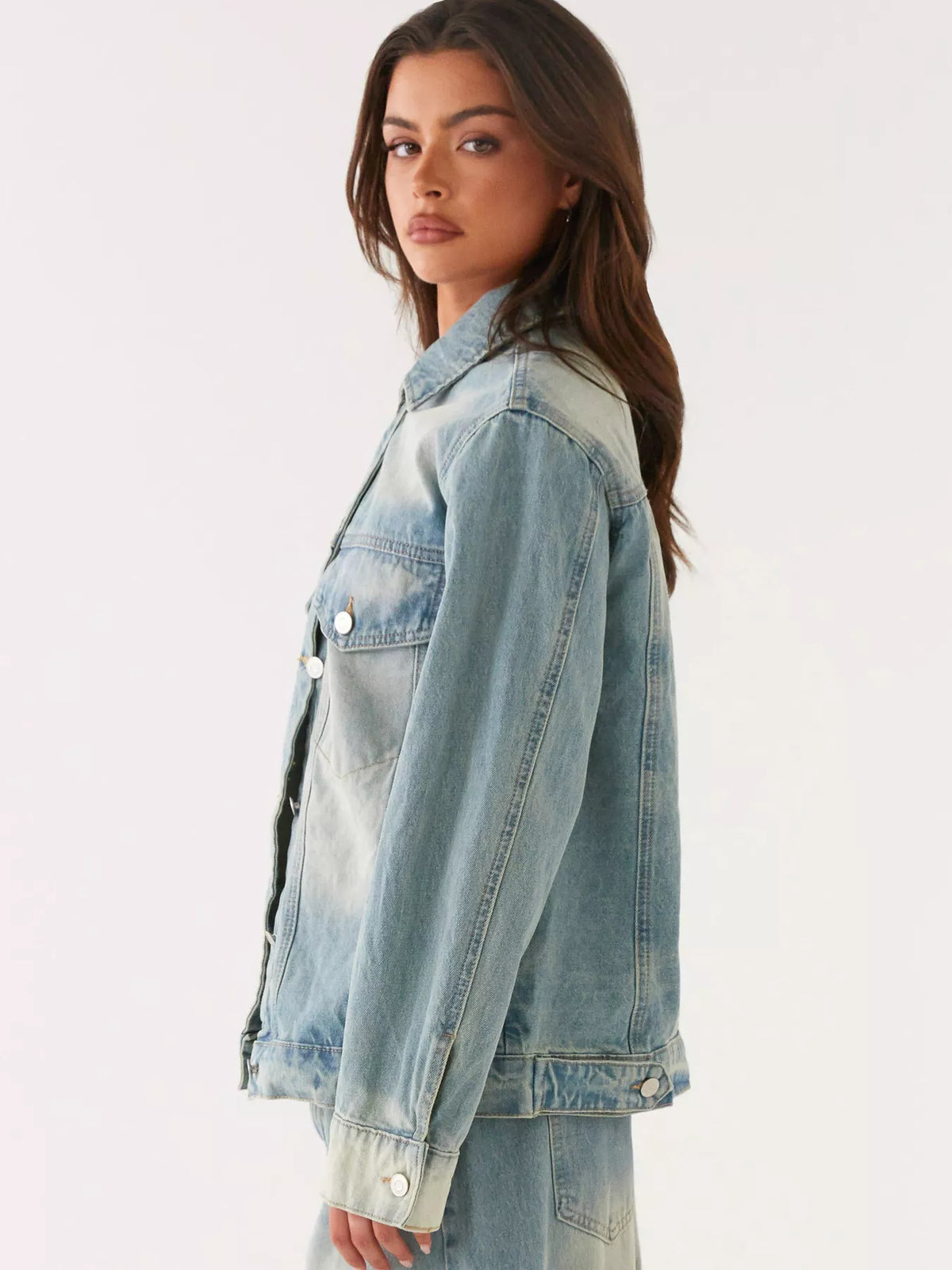 Denim jacket and jeans coordinated look detail