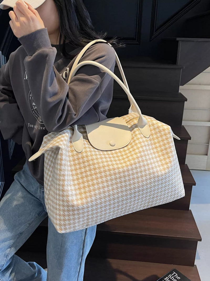 Plaid pattern canvas travel duffel bag in beige front view