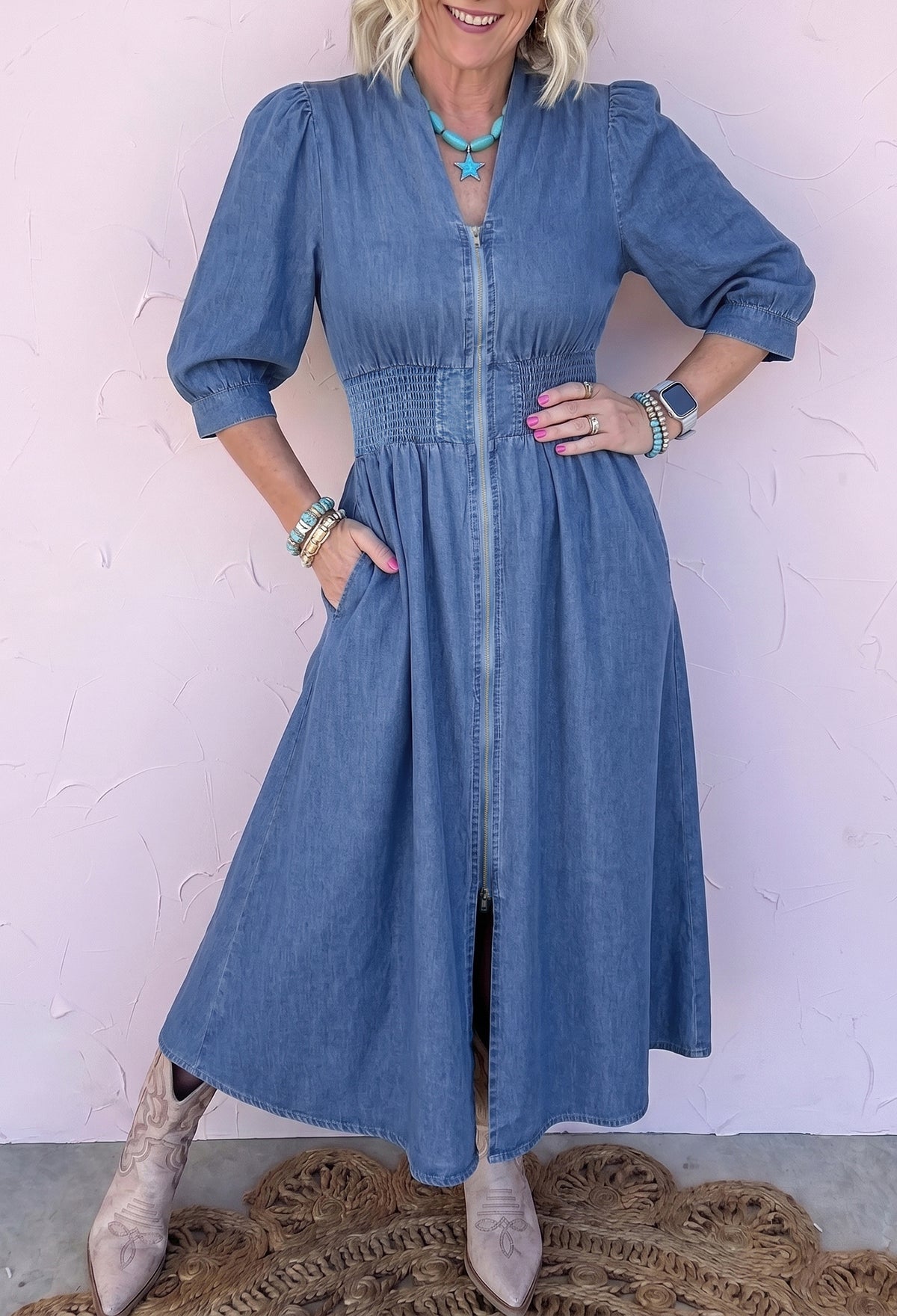 Side view of blue denim A-line midi dress