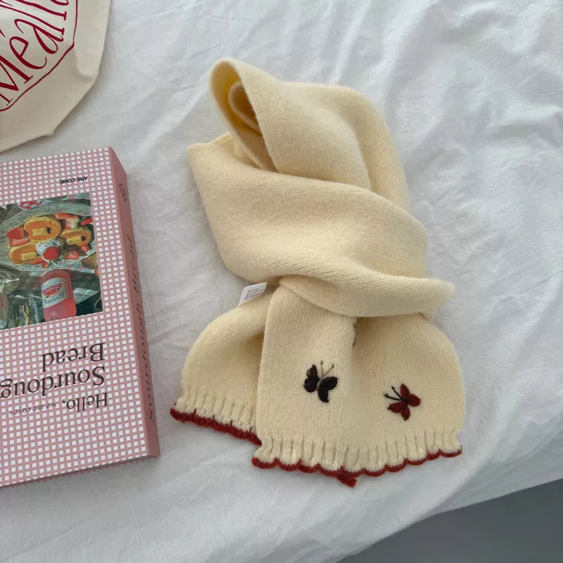 Butterfly embroidered scarf shown in a neutral tone