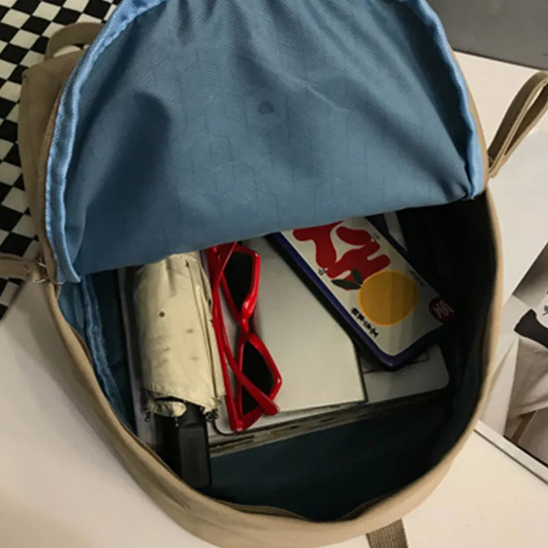 Cotton zip top backpack shoulder strap detail