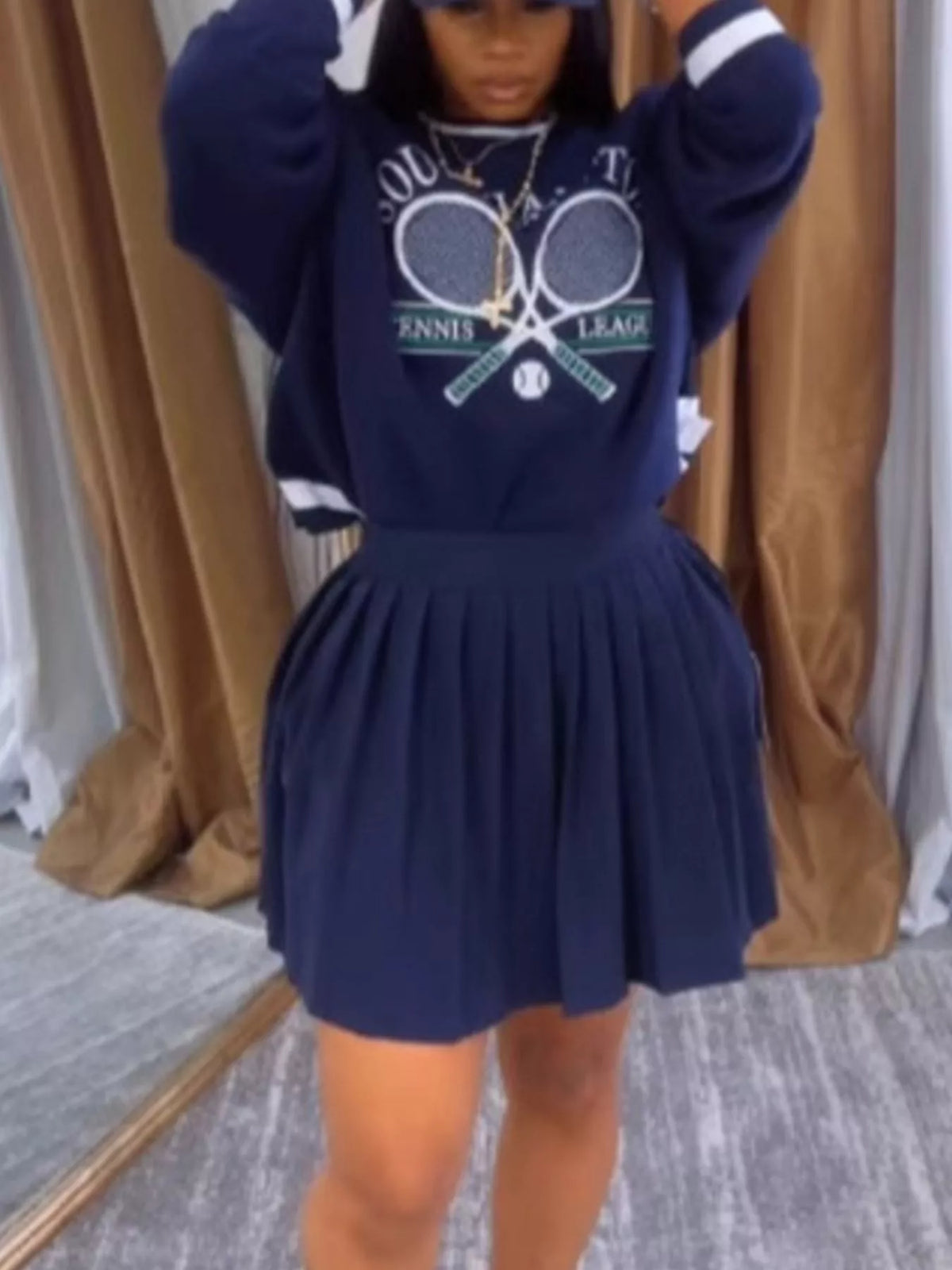 Navy blue coordinated sweatshirt and pleated skirt set styled outfit