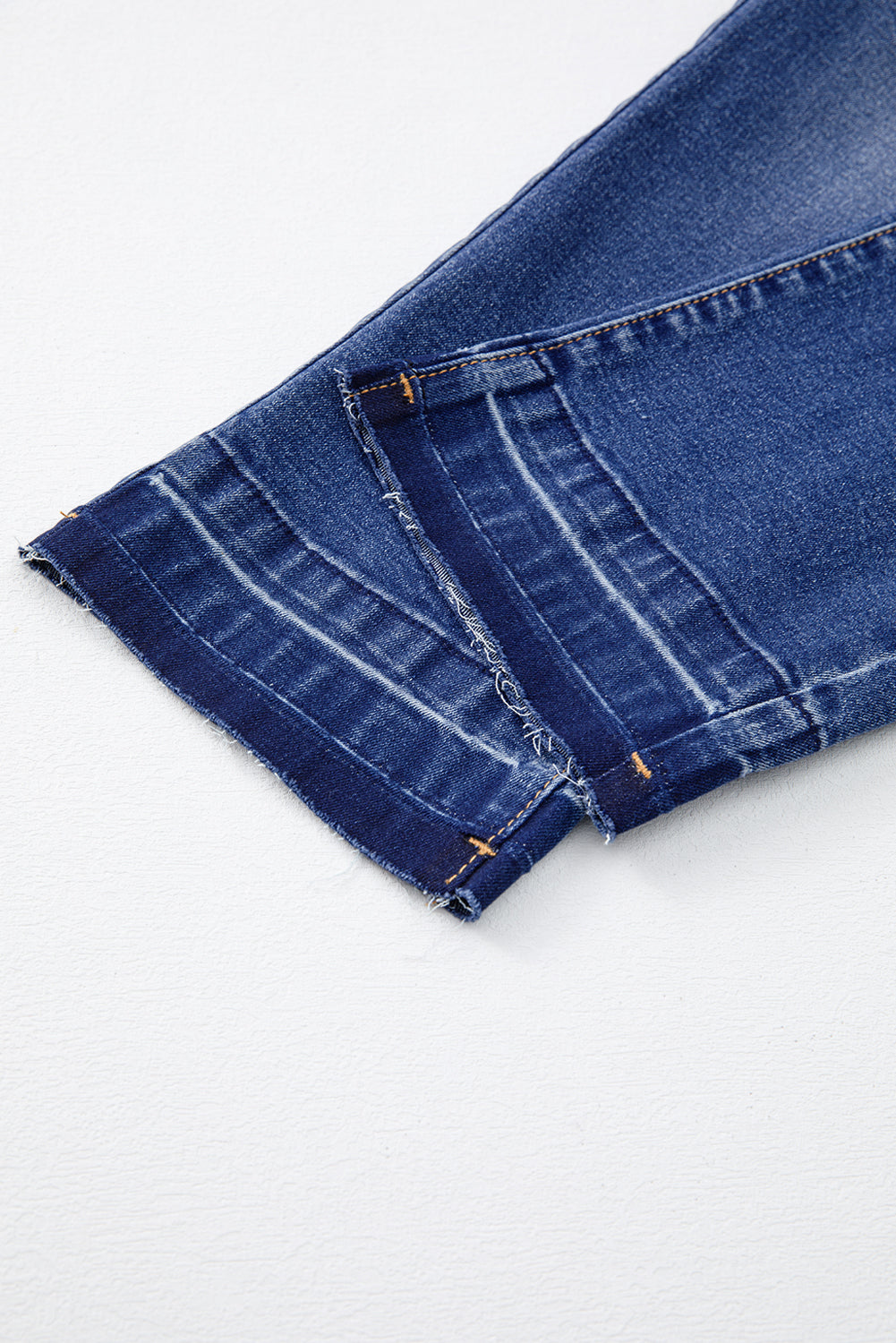 Dark blue whiskered jeans full length view