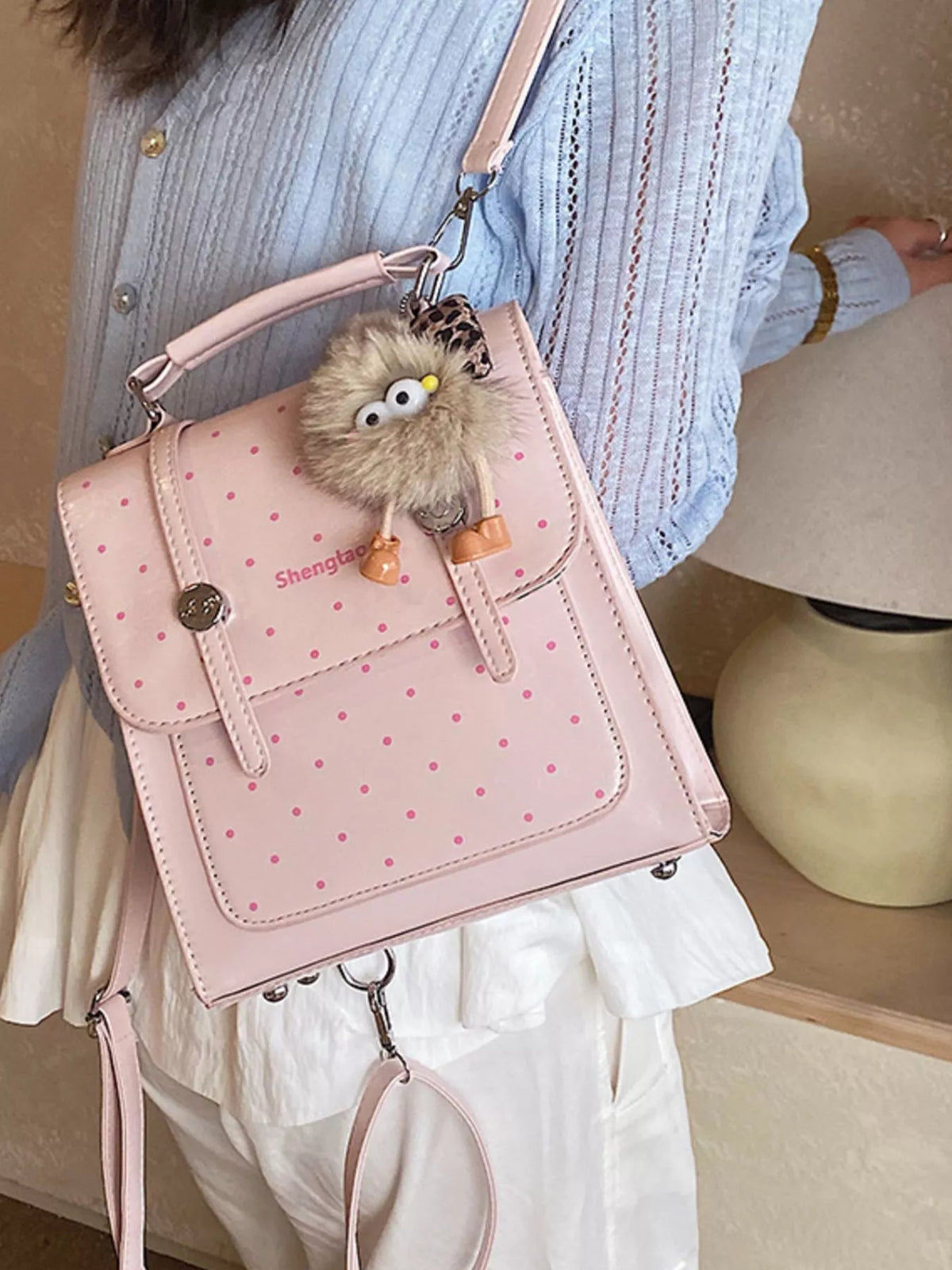 Blush pink polka dot mini backpack zip and hardware detail