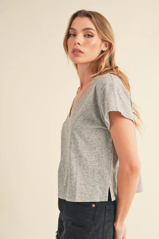 V neck and side slit detail on crop top close up