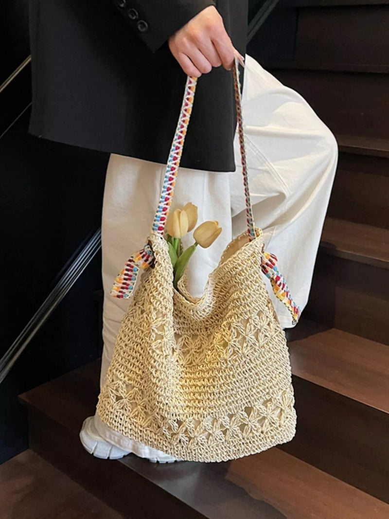Woven straw shoulder bag in natural beige front view