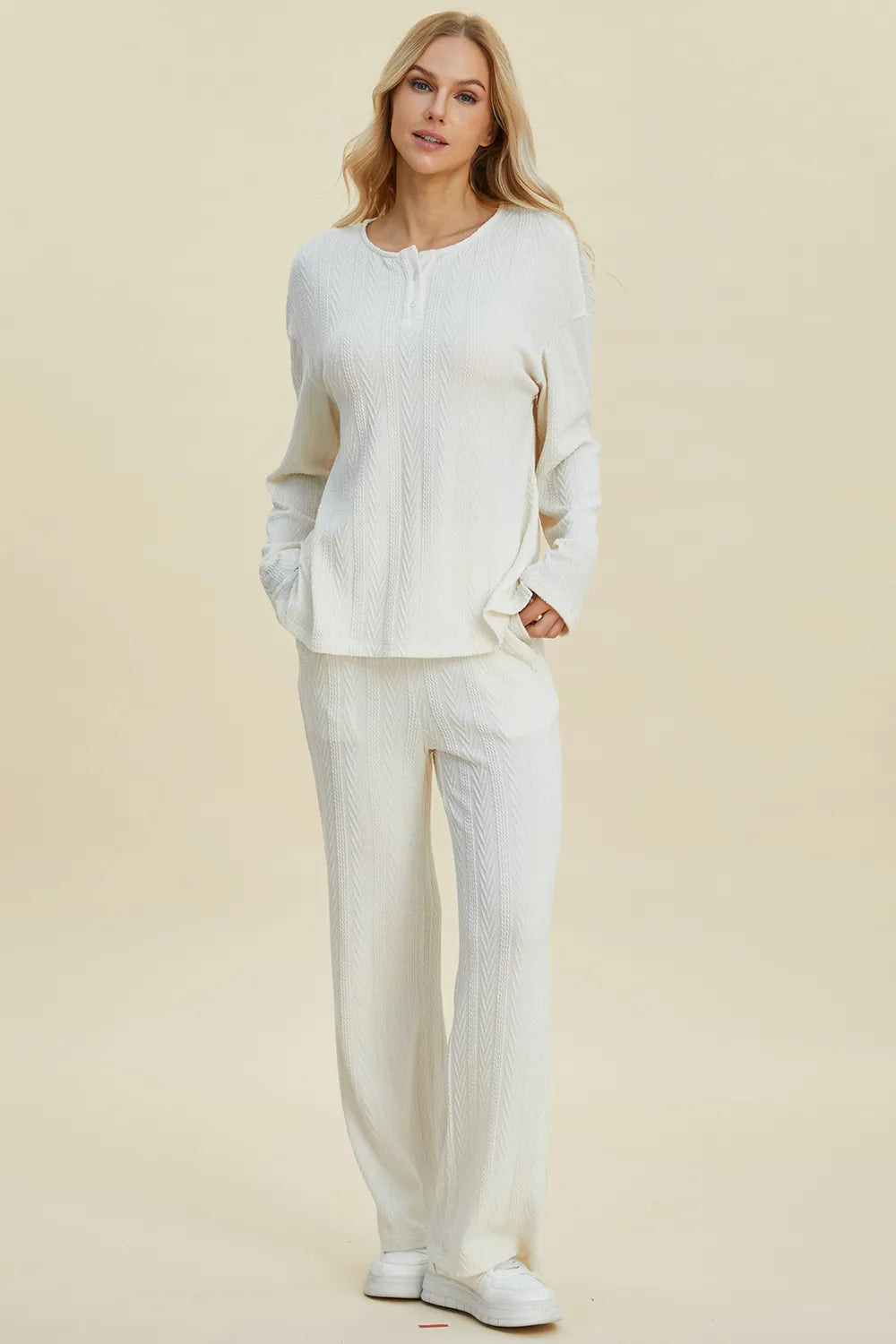 Seated view showing the drape of the knit pants