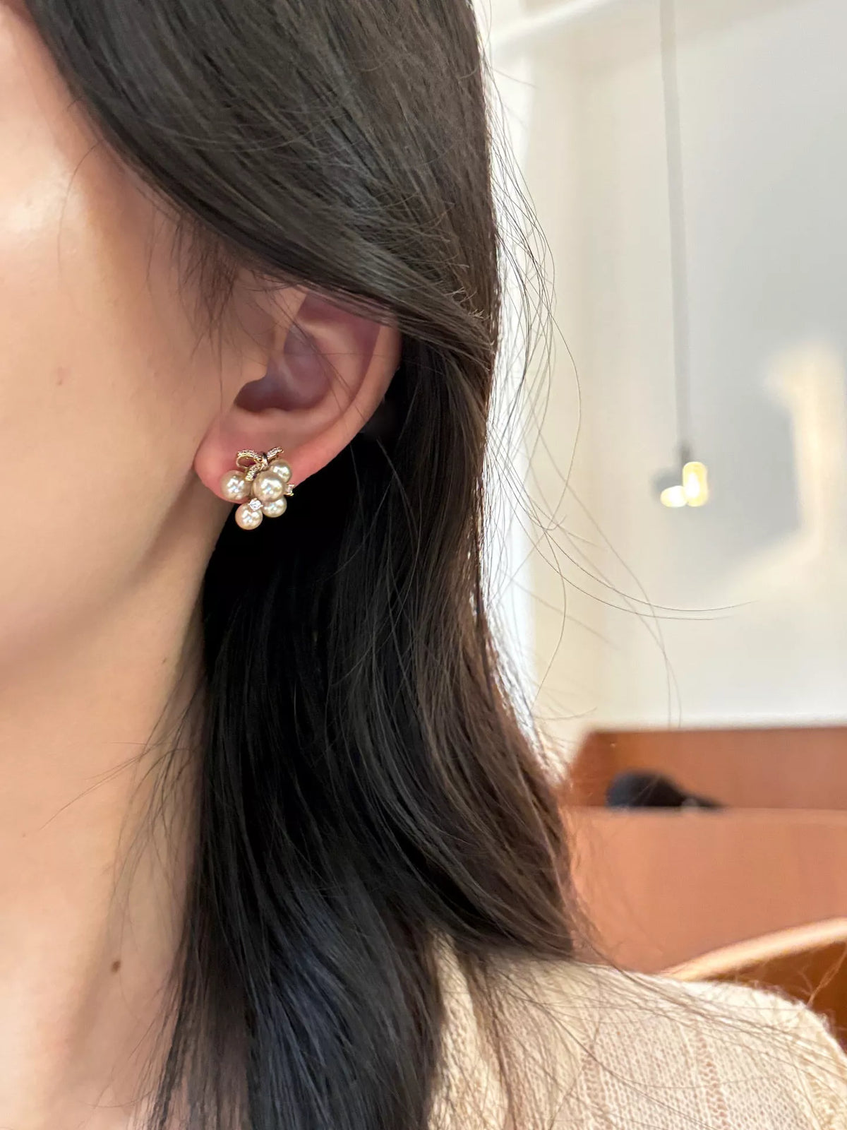 White pearl cluster bow drop earrings detail view