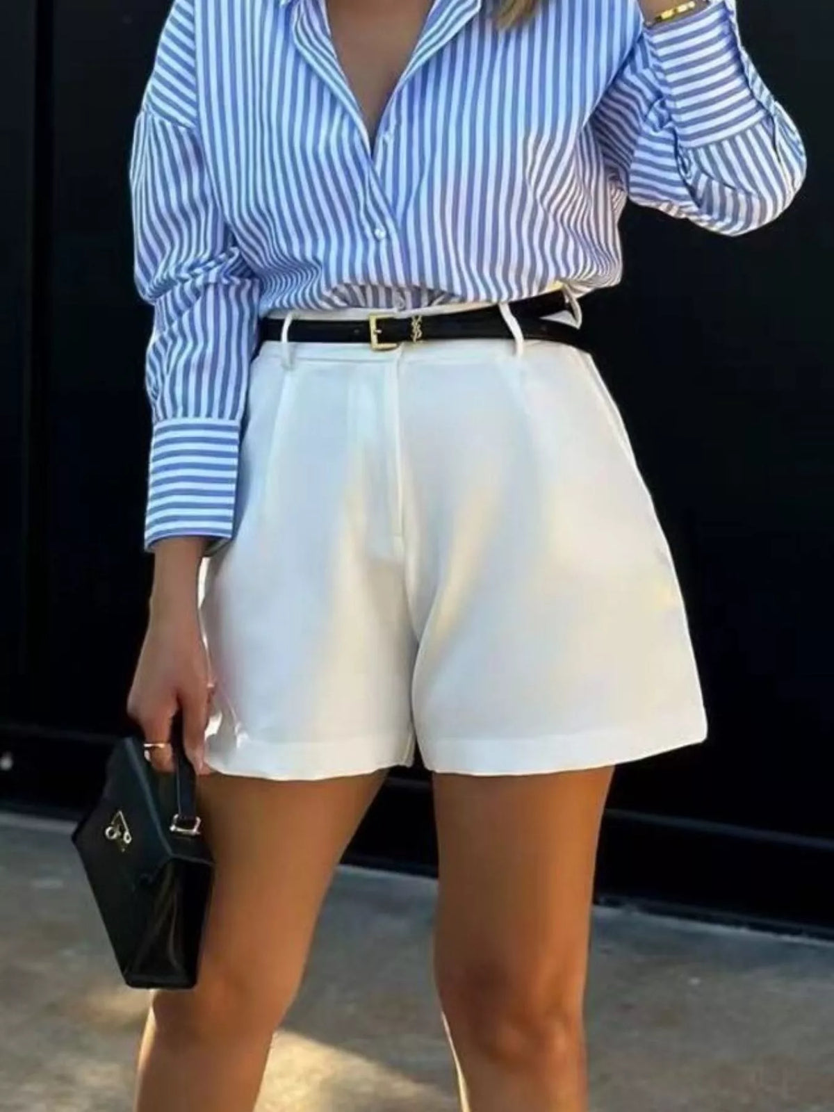 Tailored pleated shorts leg and hem detail