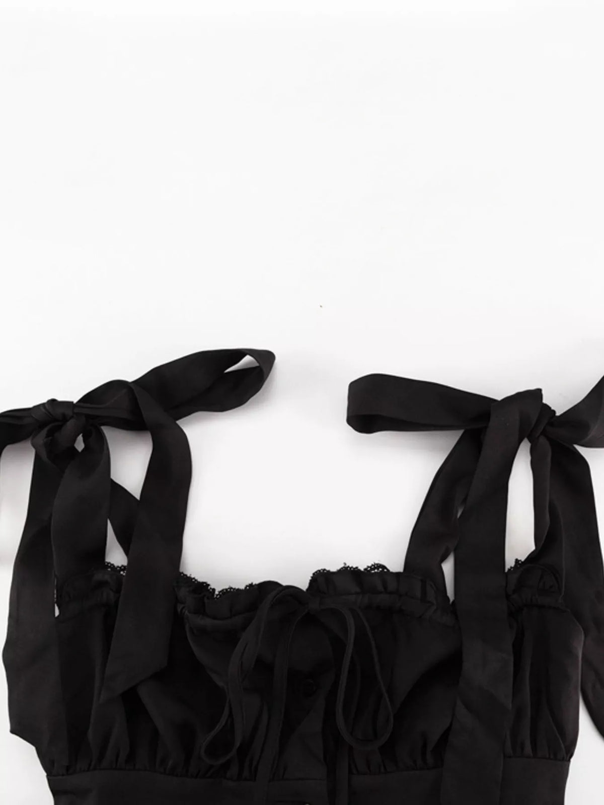 Three quarter view of the tie shoulder dress