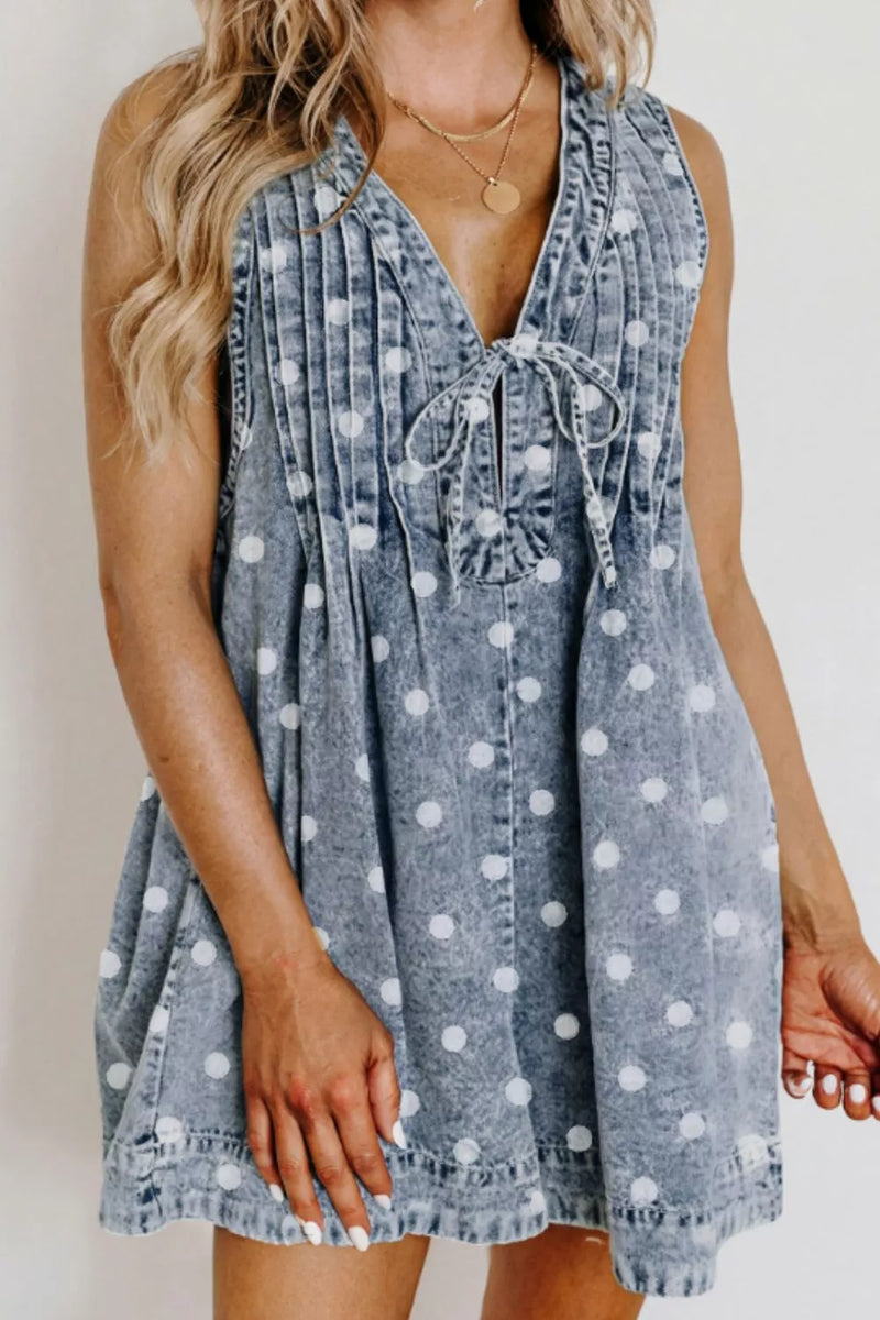 Light blue polka dot denim romper, front view