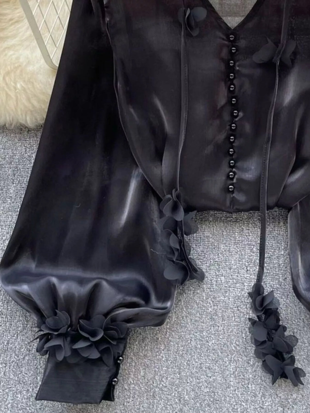 Sheer embellished shirt shown loose over jeans