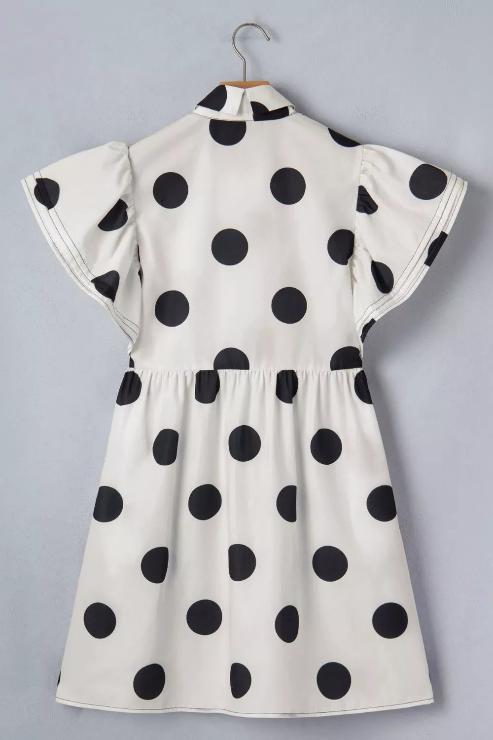 Ruffle short sleeve detail on polka dot dress