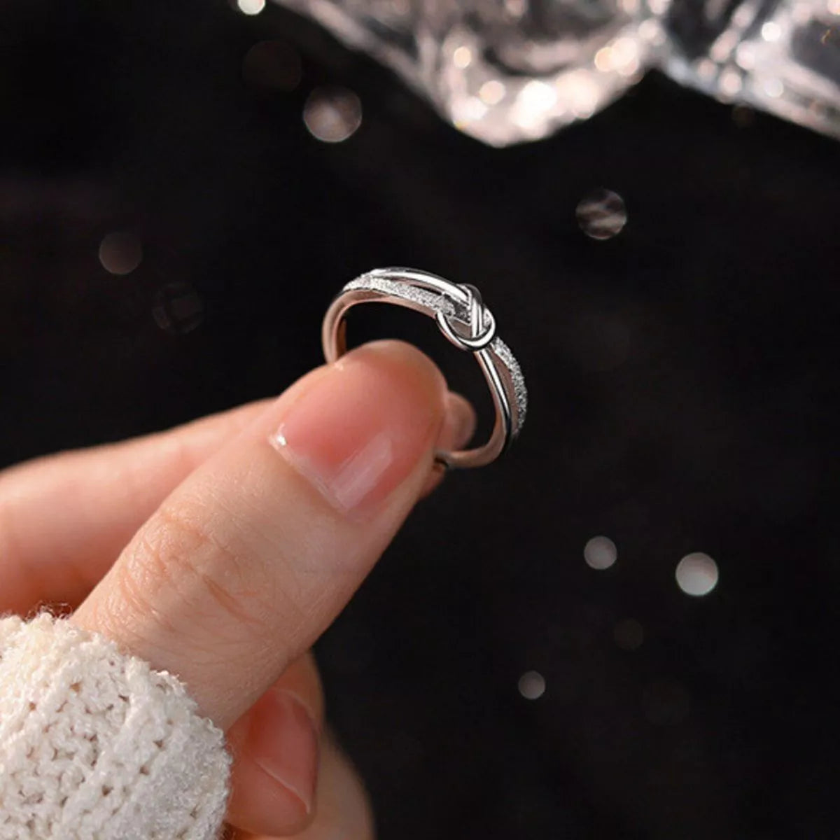 Sterling silver zircon knot ring side view