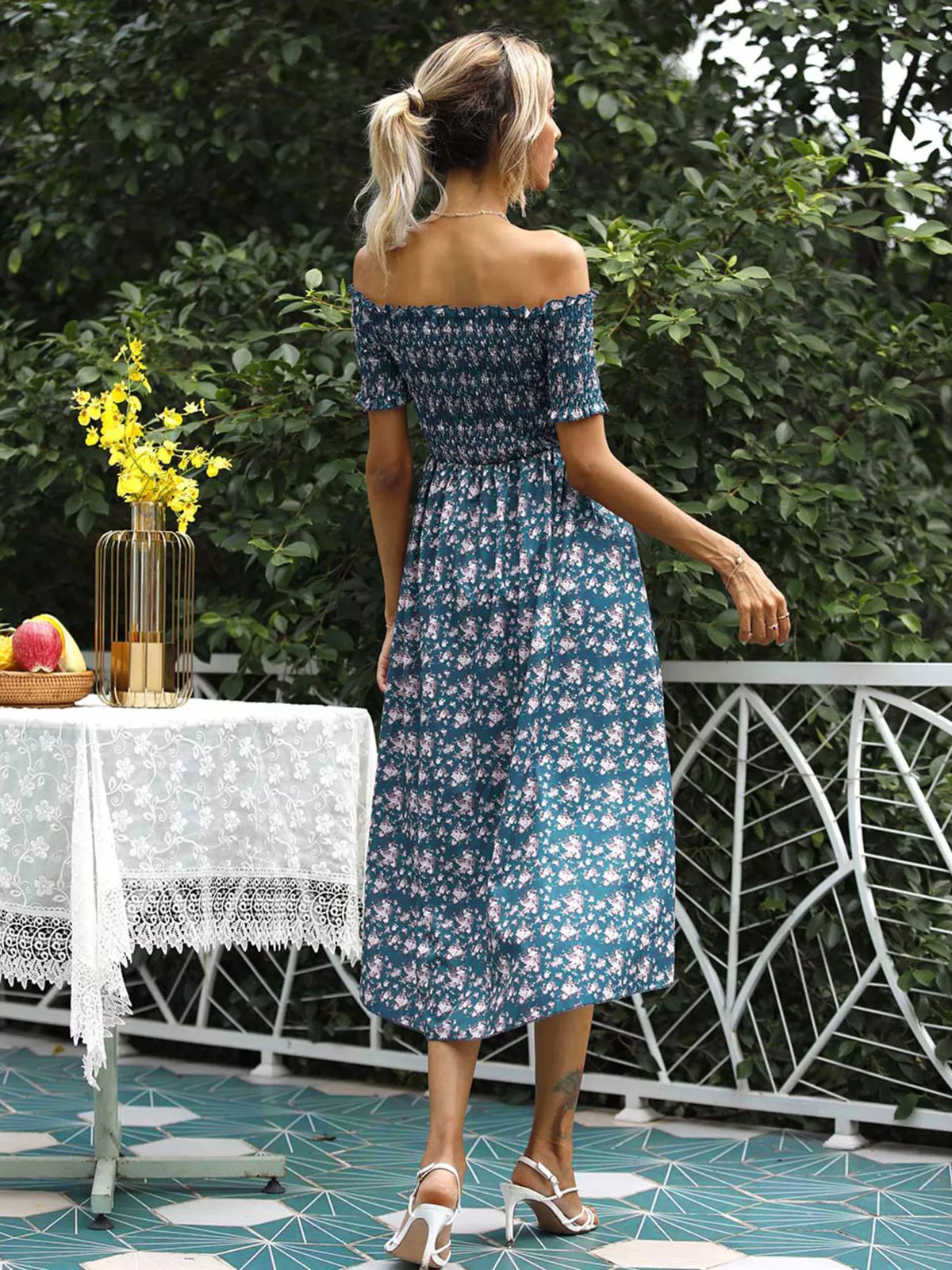 Front view of the off shoulder floral slit dress