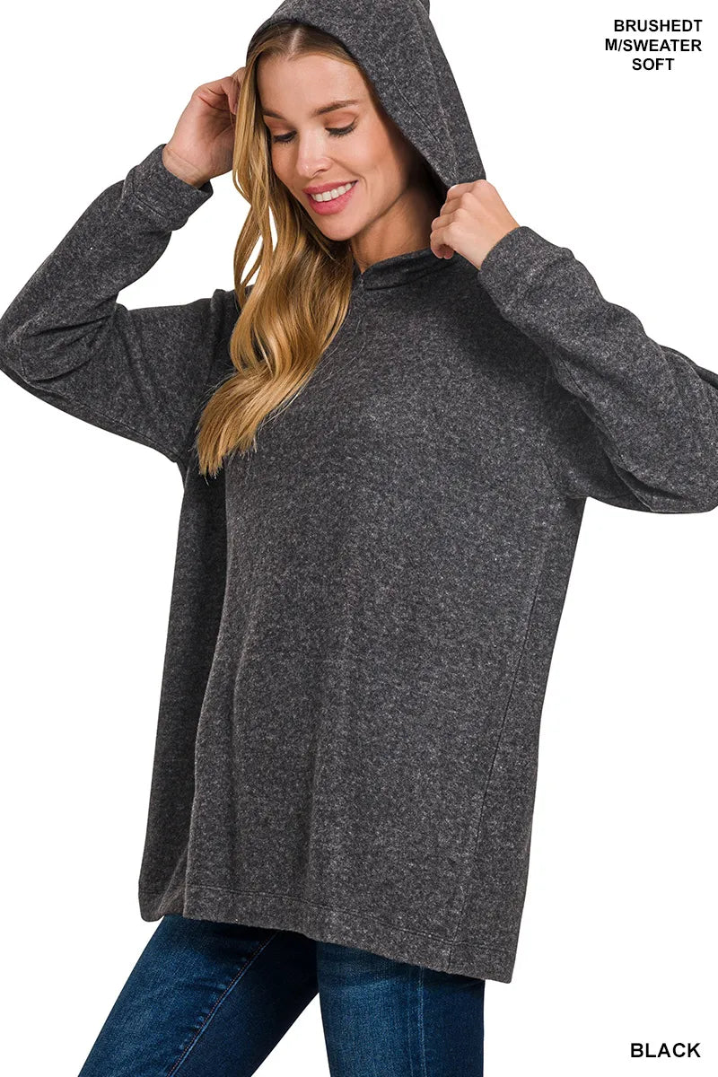 Black hooded pullover sweater shown on model