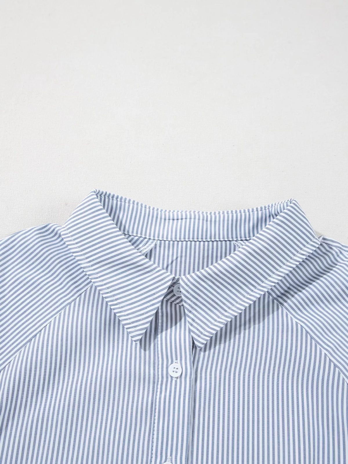Blouse layered under a knit vest