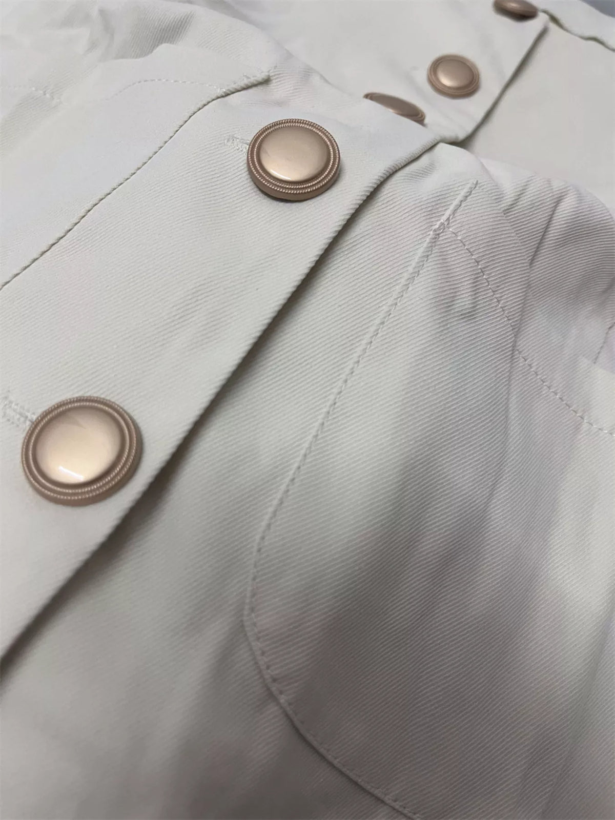 Beige button down sleeveless utility vest full length view