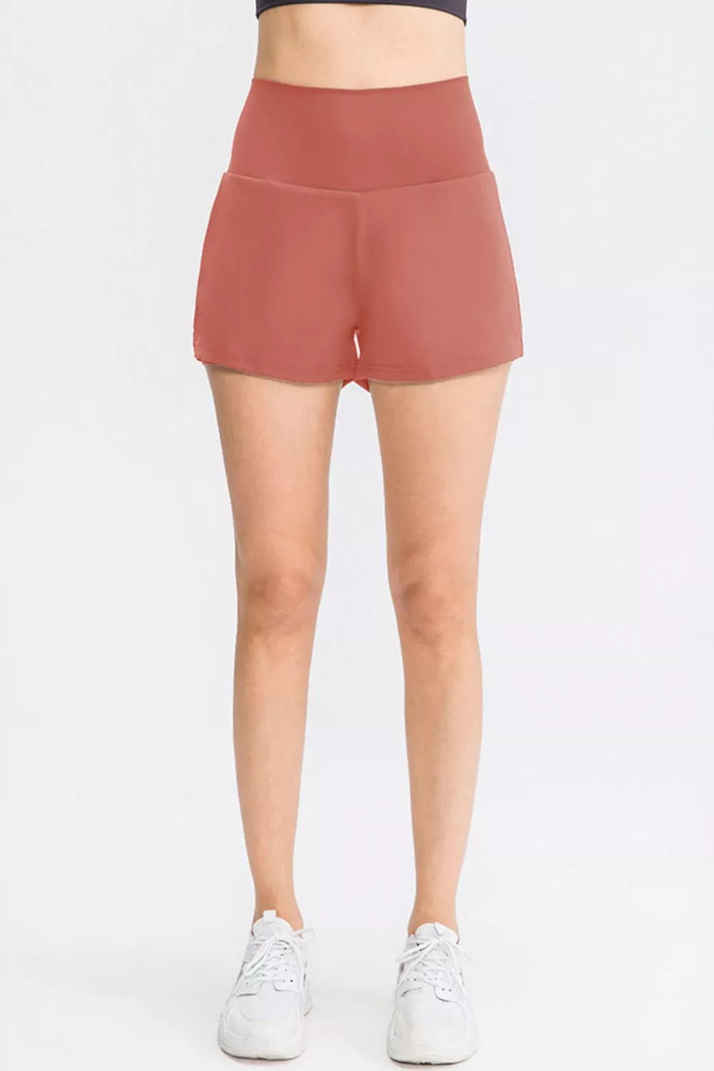 Wide waistband sports shorts with pockets angled view
