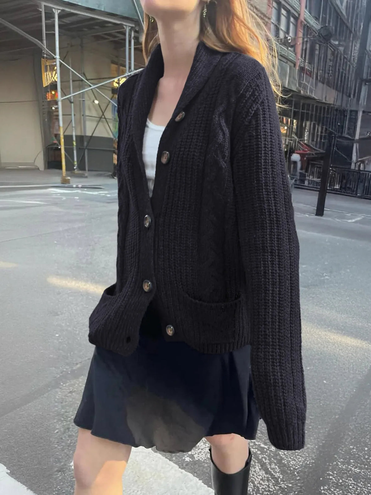 cable knit button up cardigan three quarter view