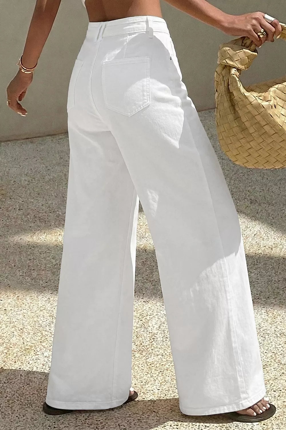 Loose fit white jeans styled with top