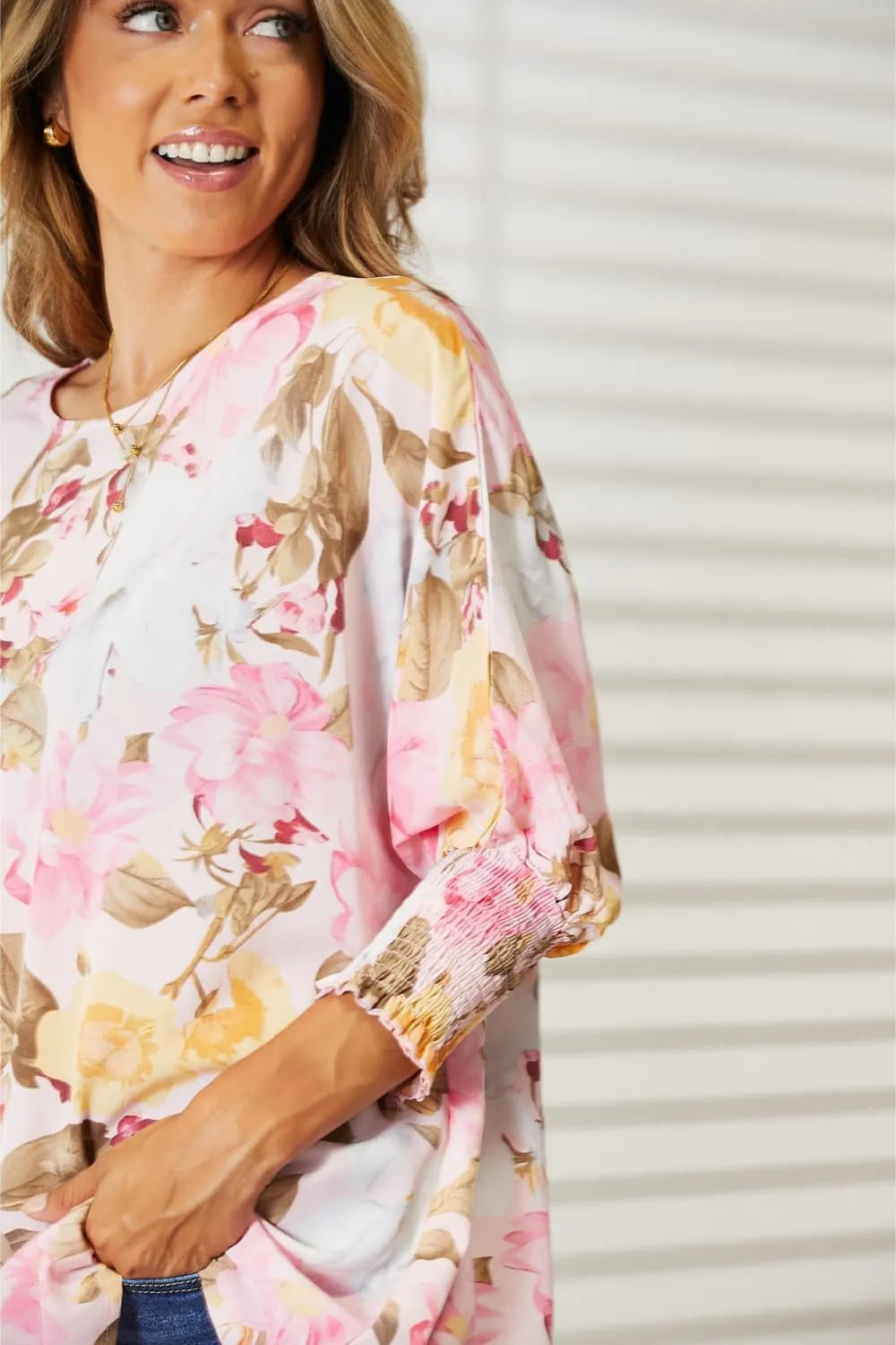 Three quarter sleeve detail on floral top
