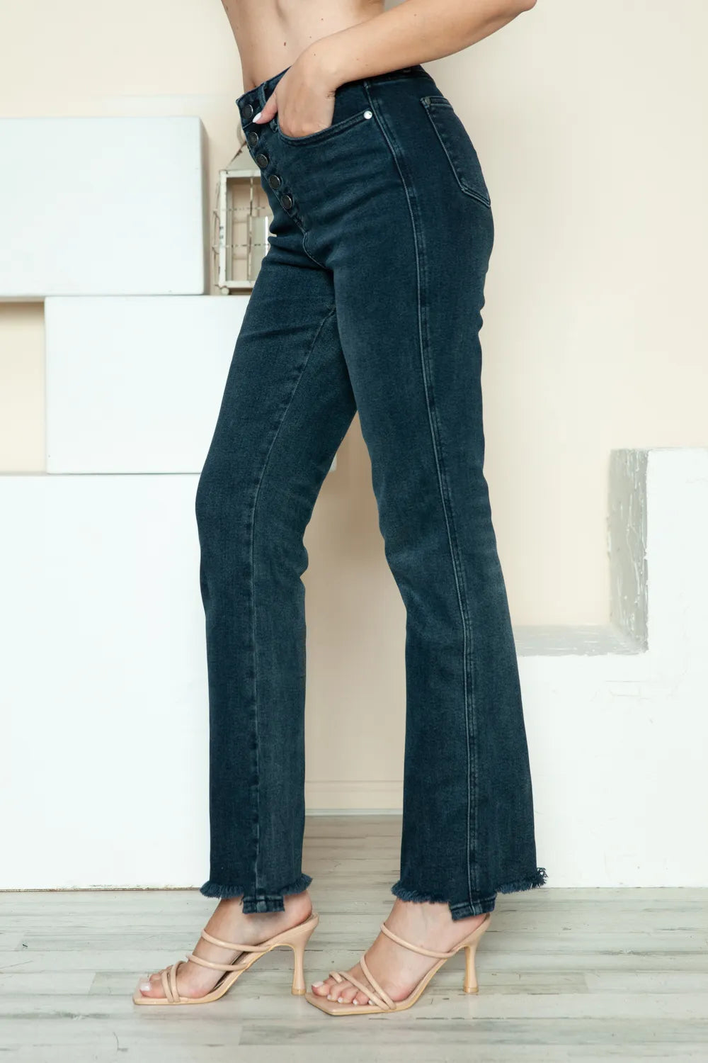 Distressed straight leg jeans shown from the side