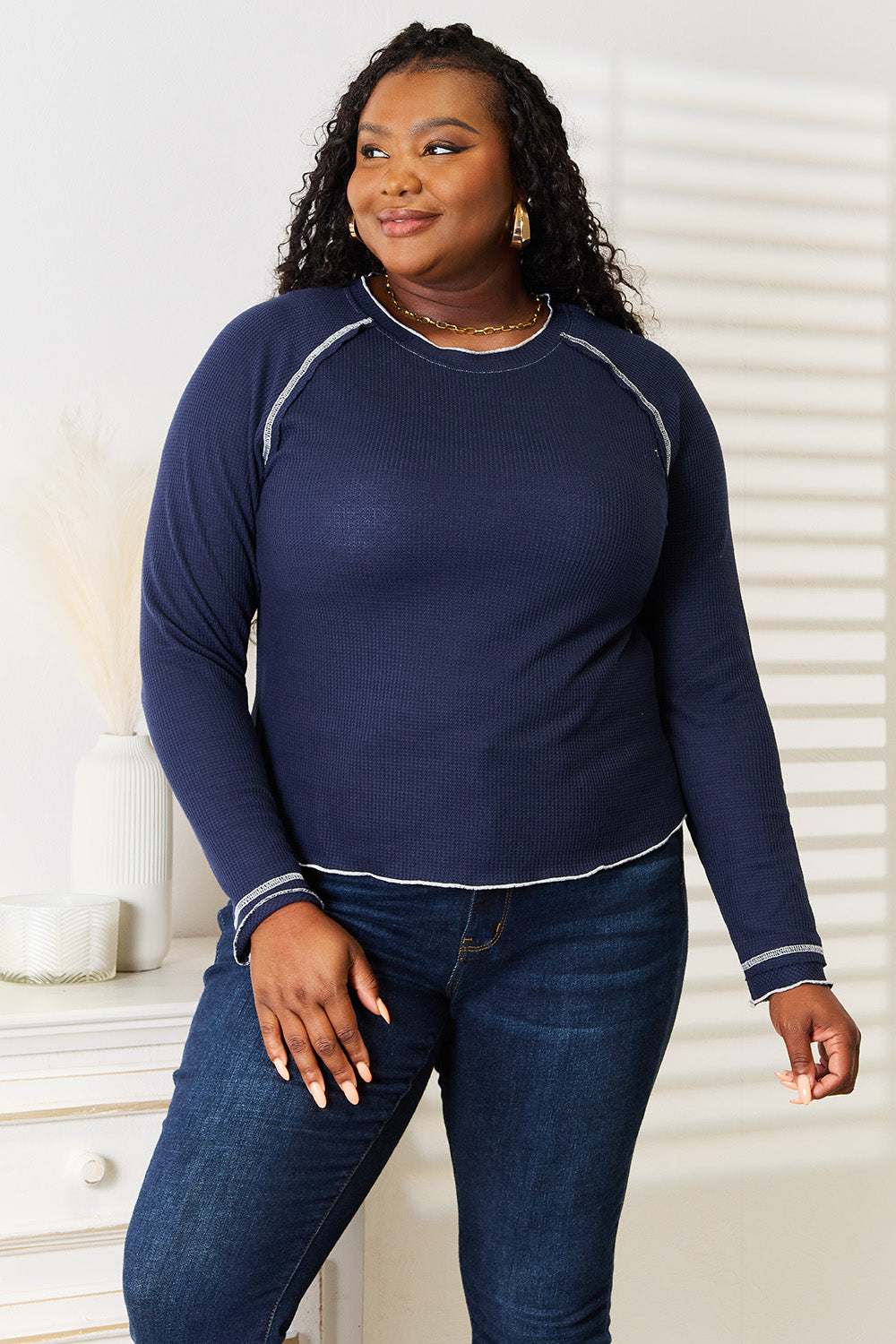 Detail of the round neckline and knit fabric