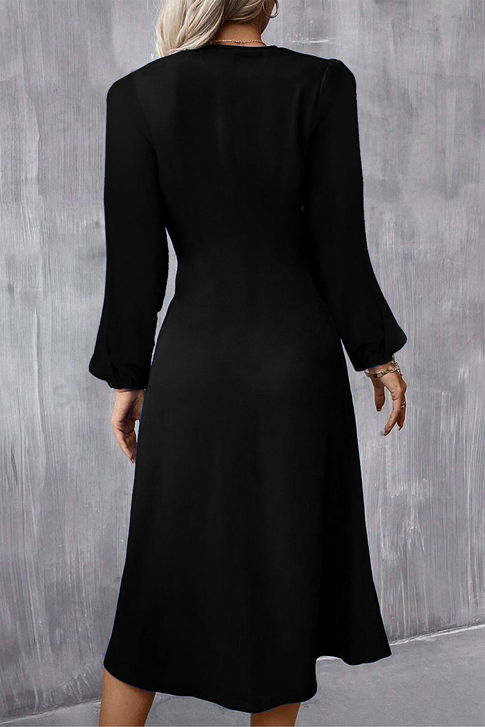 Neckline detail of elegant ruched midi dress
