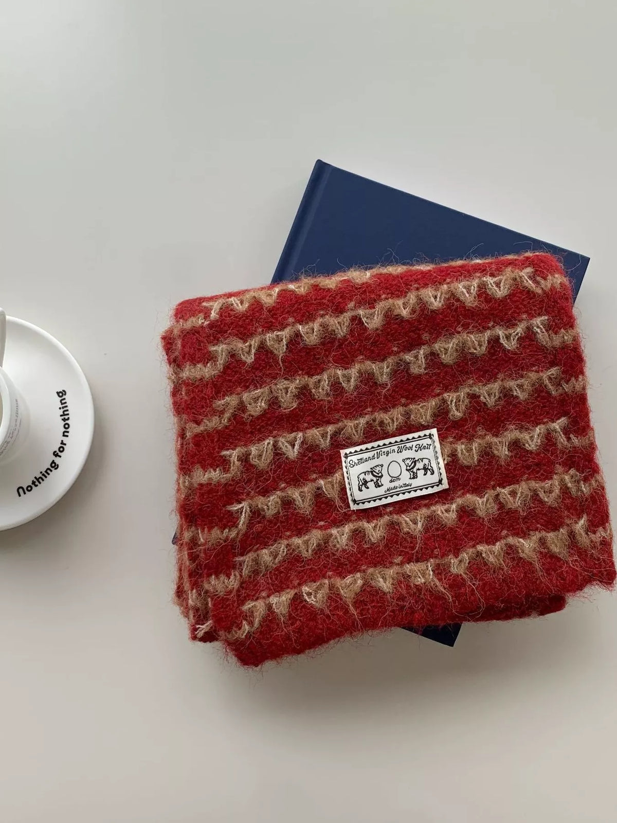Cozy vintage knit scarf shown looped