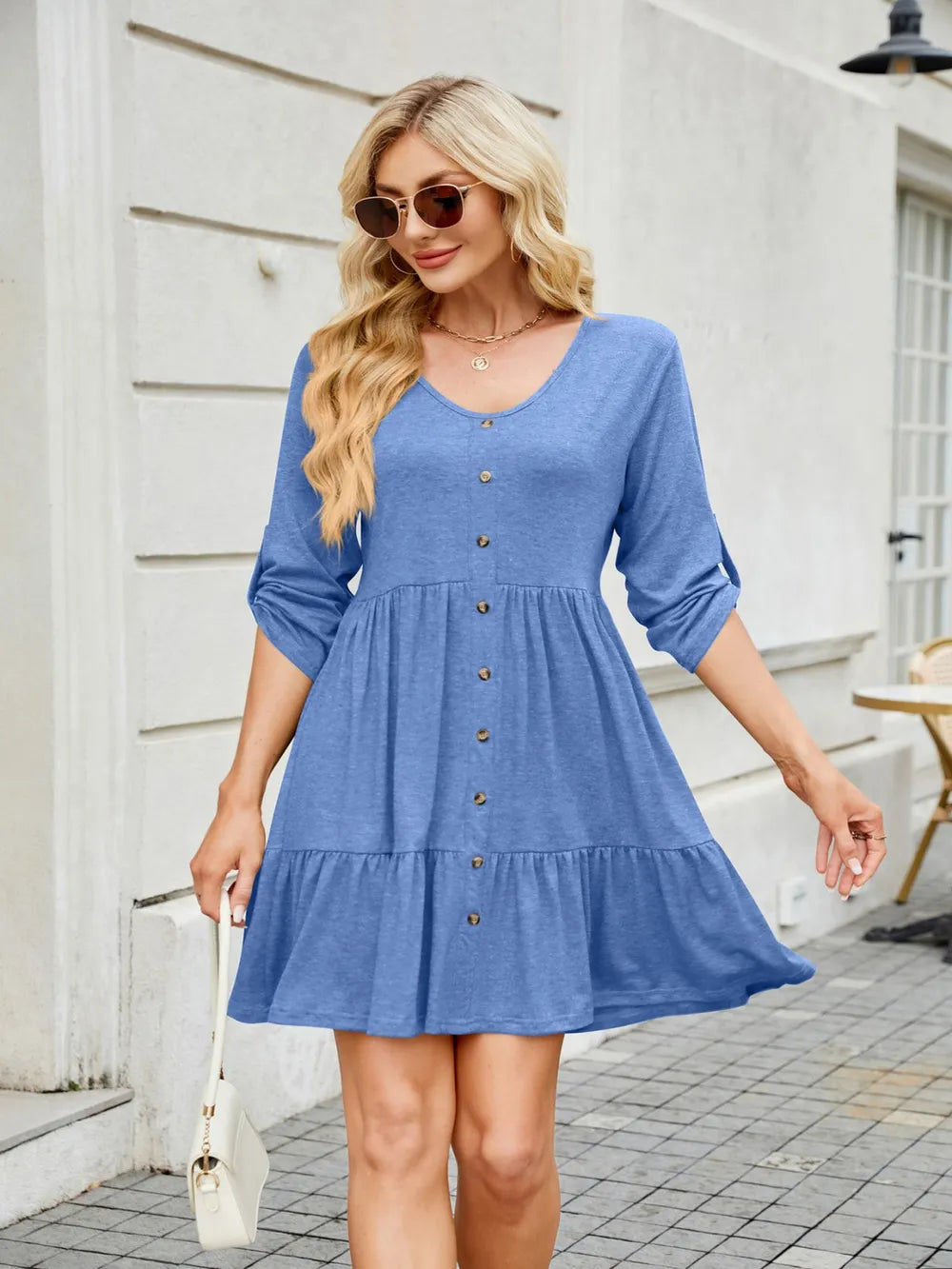 Detail of ruching on V-neck mini dress