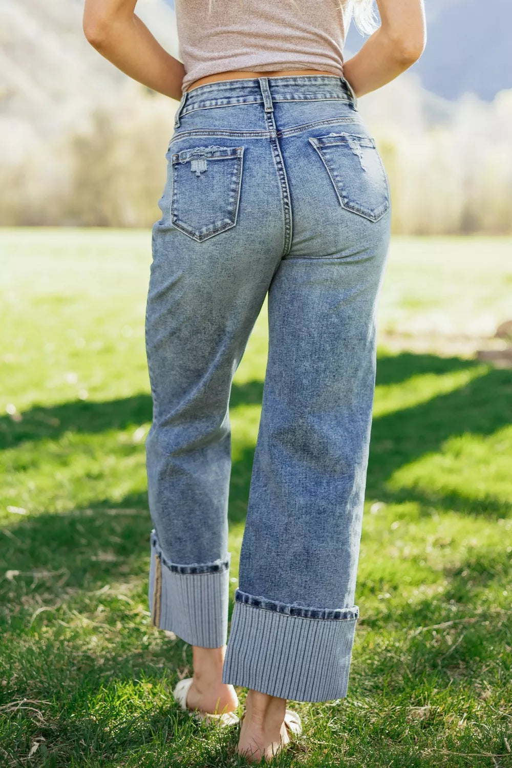 Loose straight leg jeans showing cuffed hem