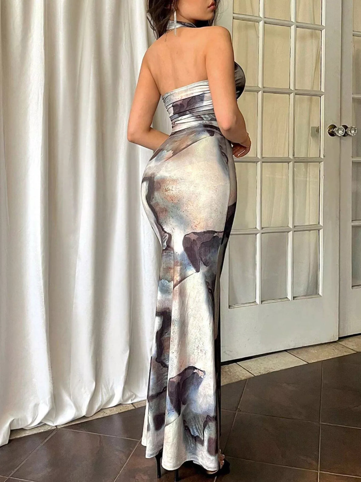 Tie dye halter and mermaid skirt profile view