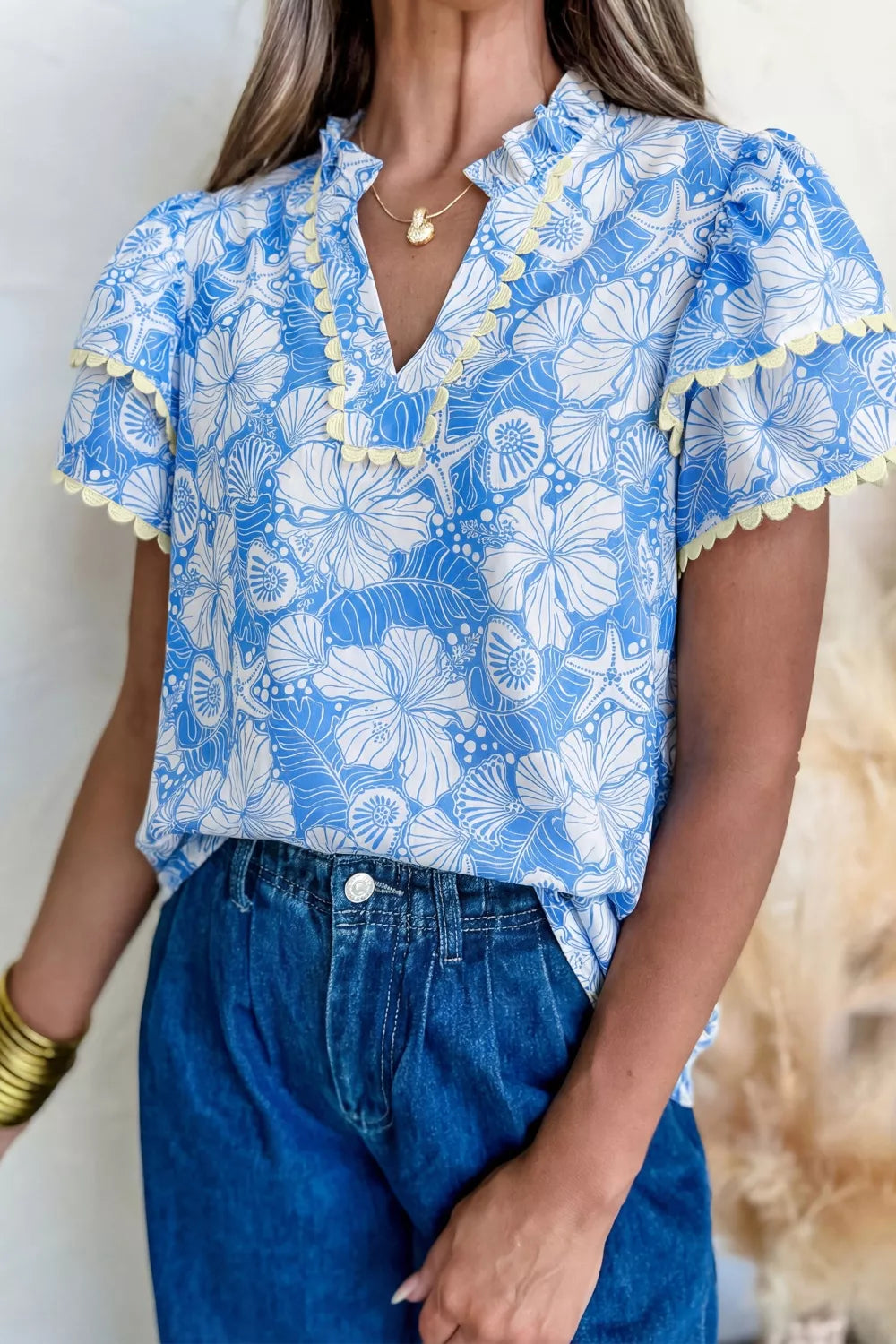 Light blue floral scalloped trim v neck blouse side view