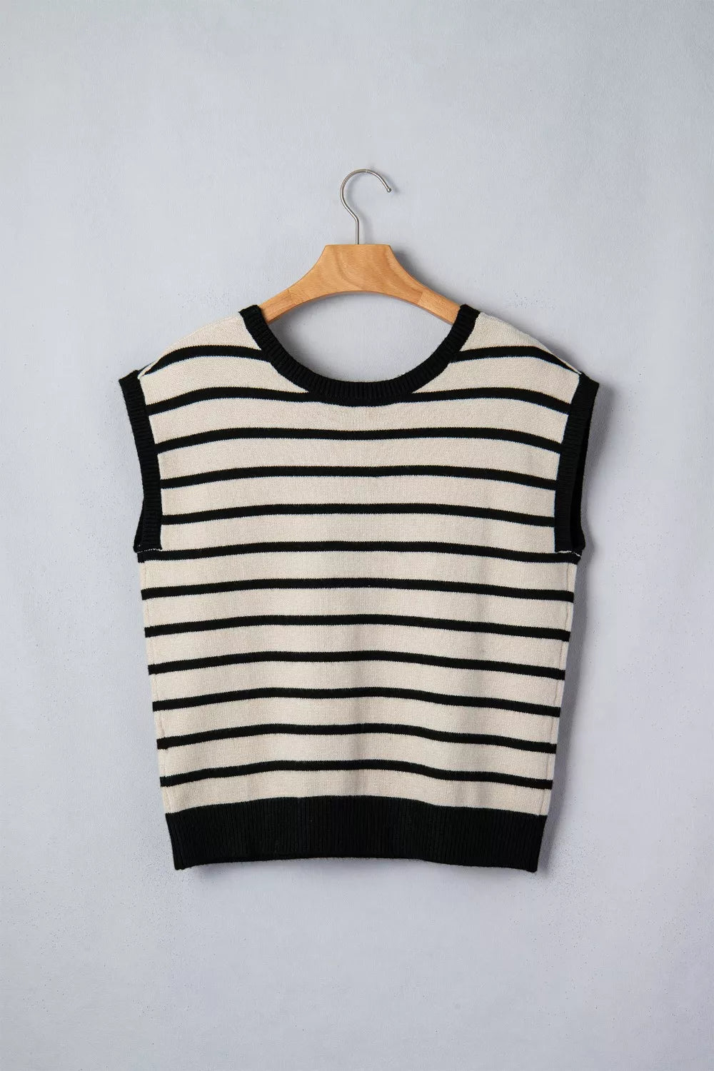 Black knit bow sweater styled on model