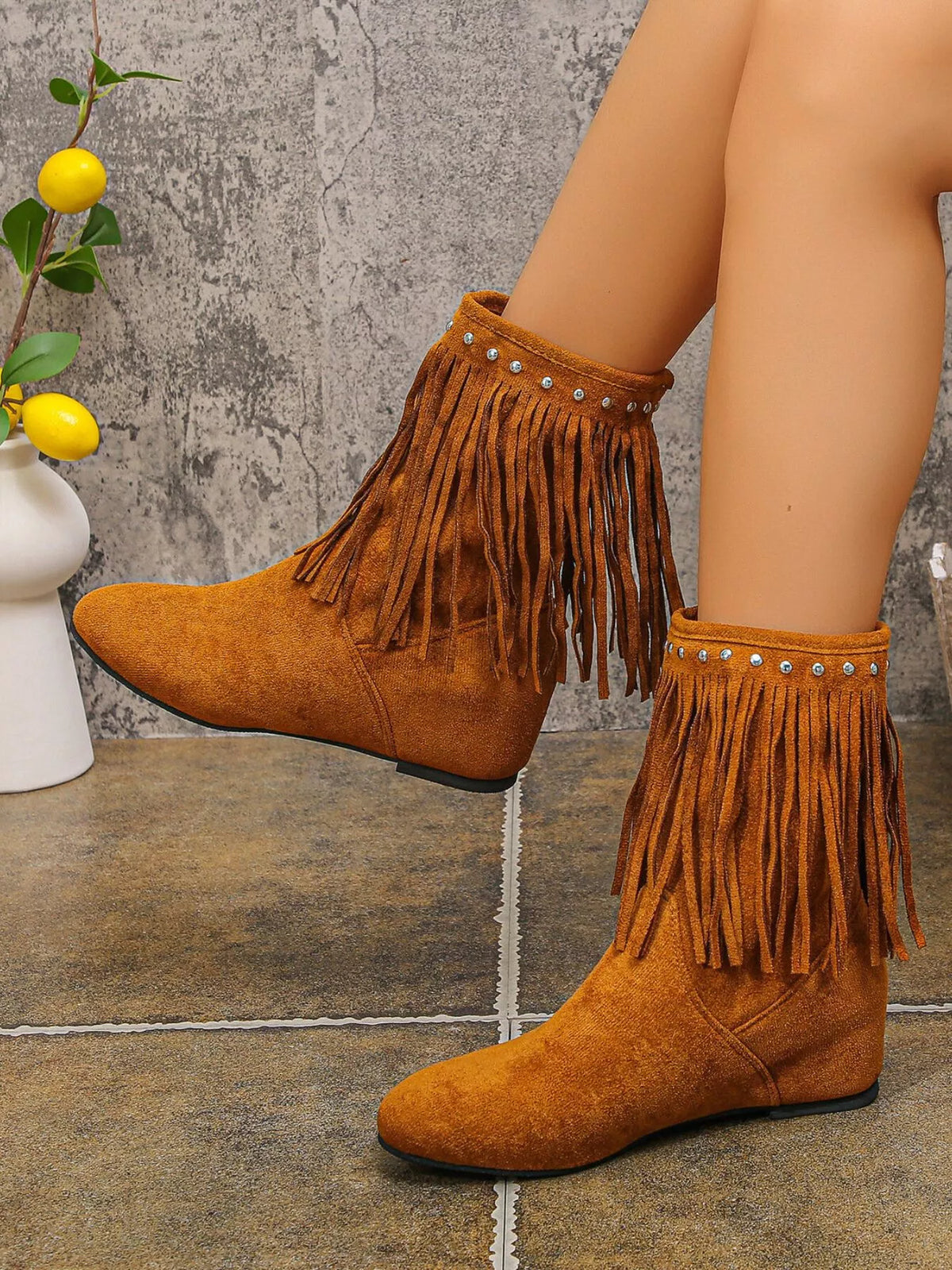 Studded fringe boots toe close up