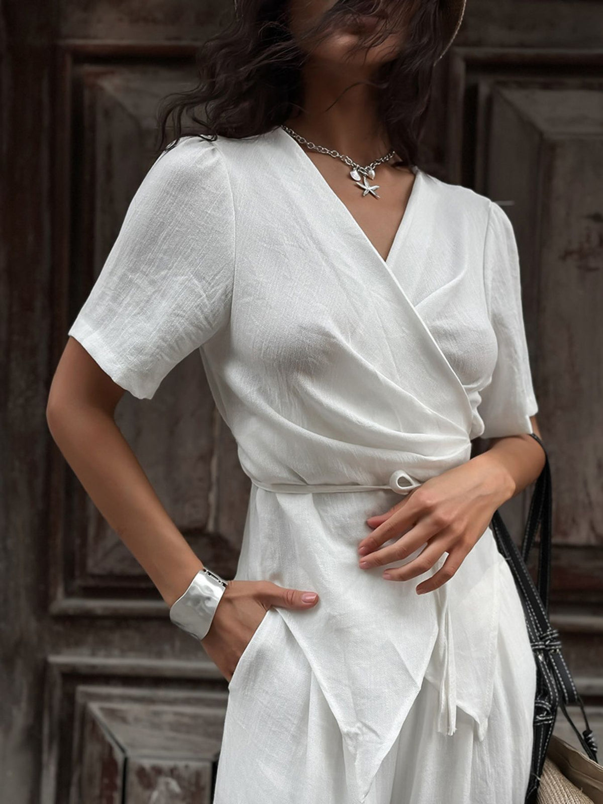White wide leg pants tie waist close up