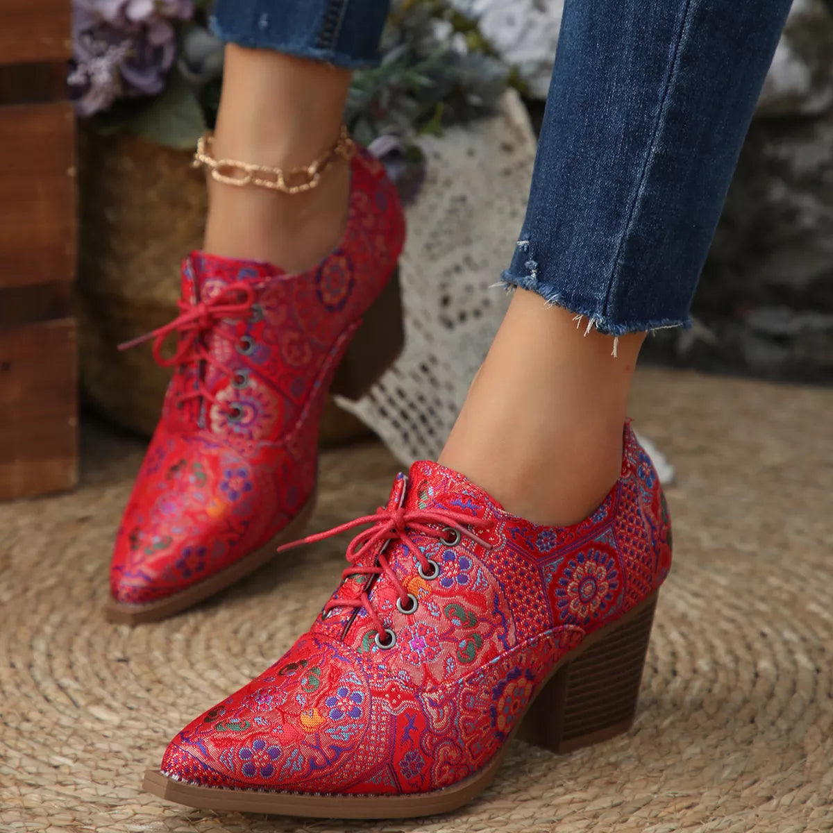 Point toe ankle boots worn on the leg