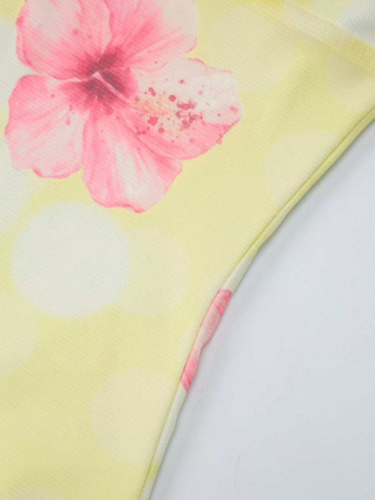 Sheer floral asymmetrical dress movement shot