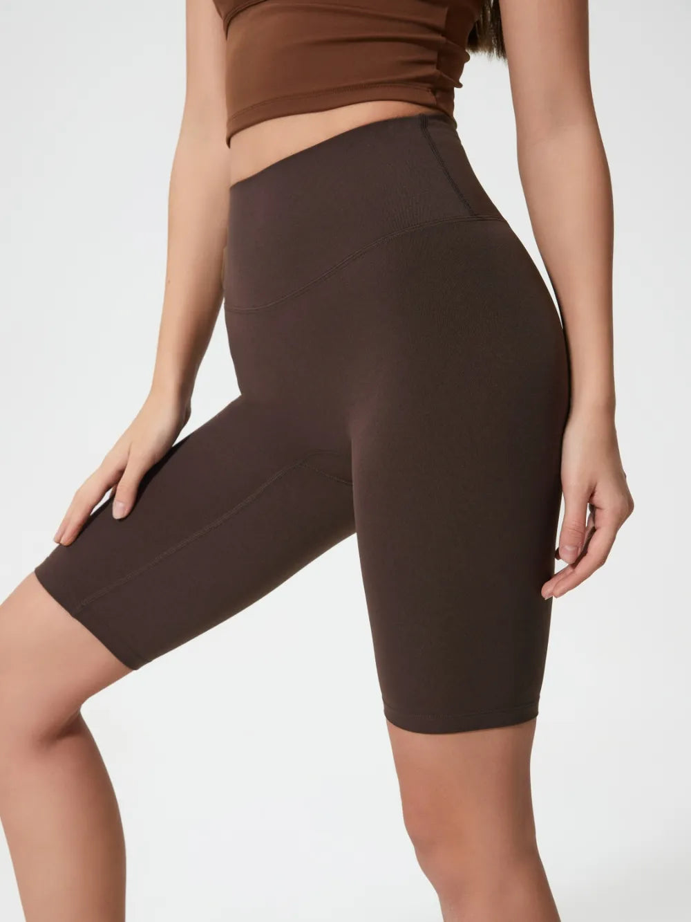 high rise wide waistband active shorts styled full length look