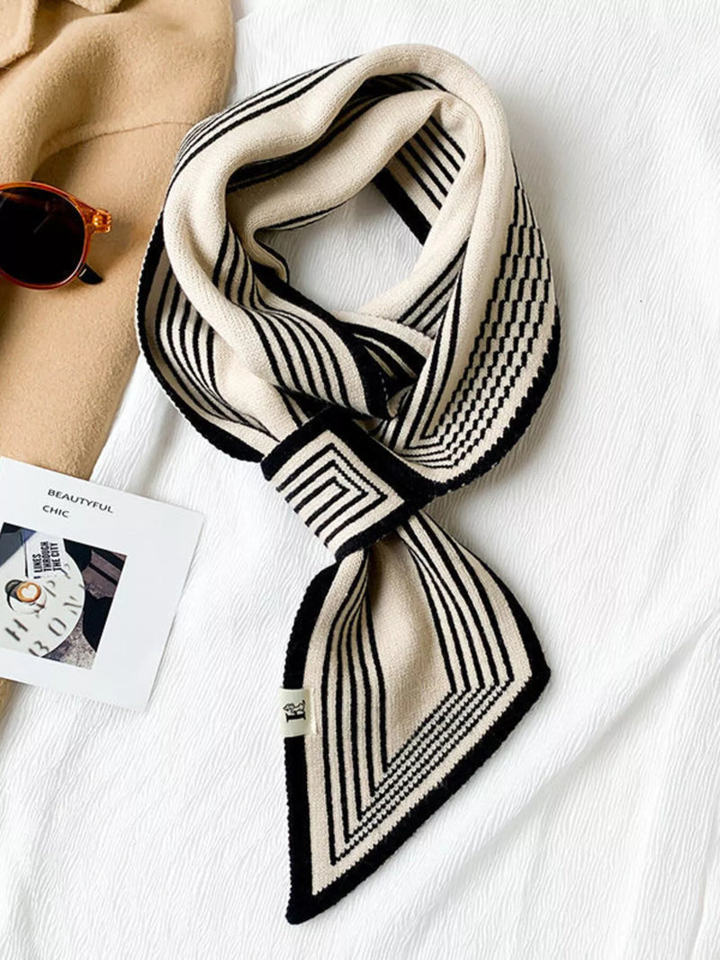 Striped knitted winter scarf around the neck