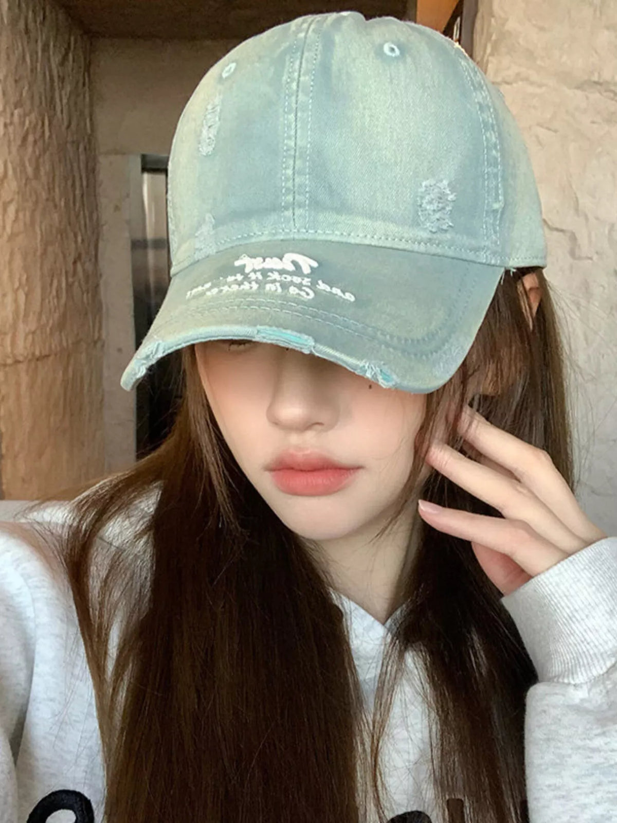 Close view of the embroidery on the front of the cap