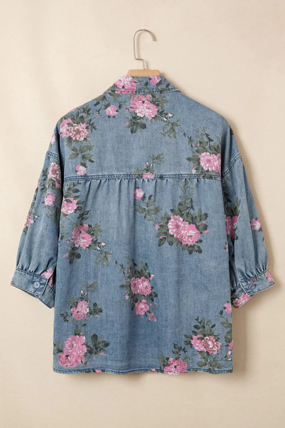 Close up of the floral print on the denim shirt