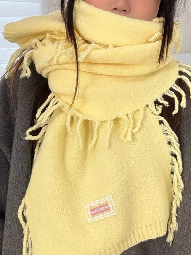 Knitted fringe scarf in a bright yellow tone