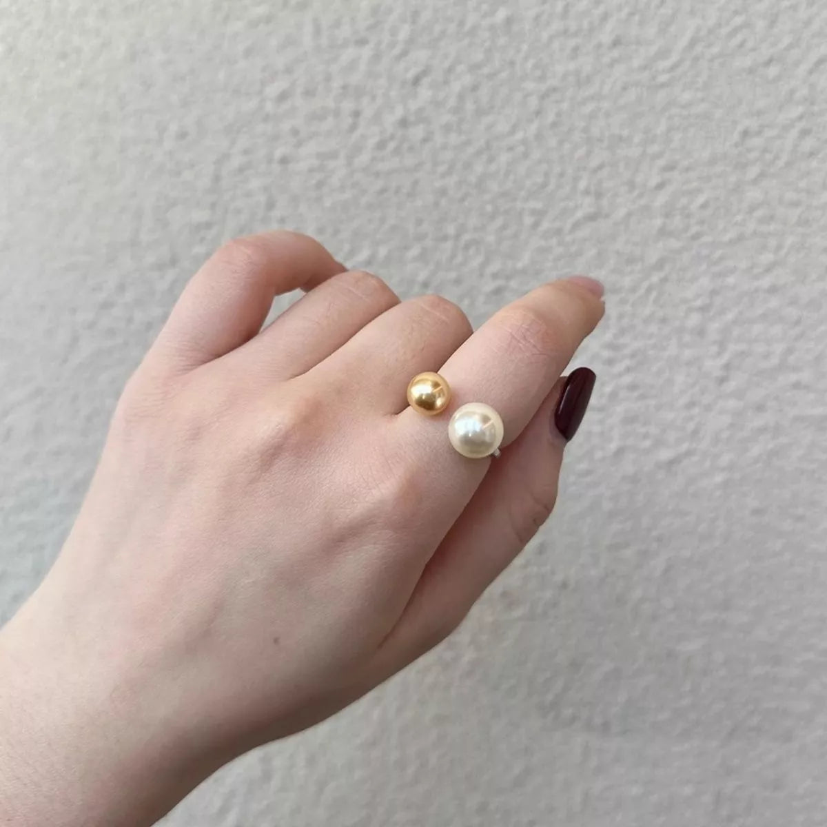 Double pearl open sterling silver ring styled on model