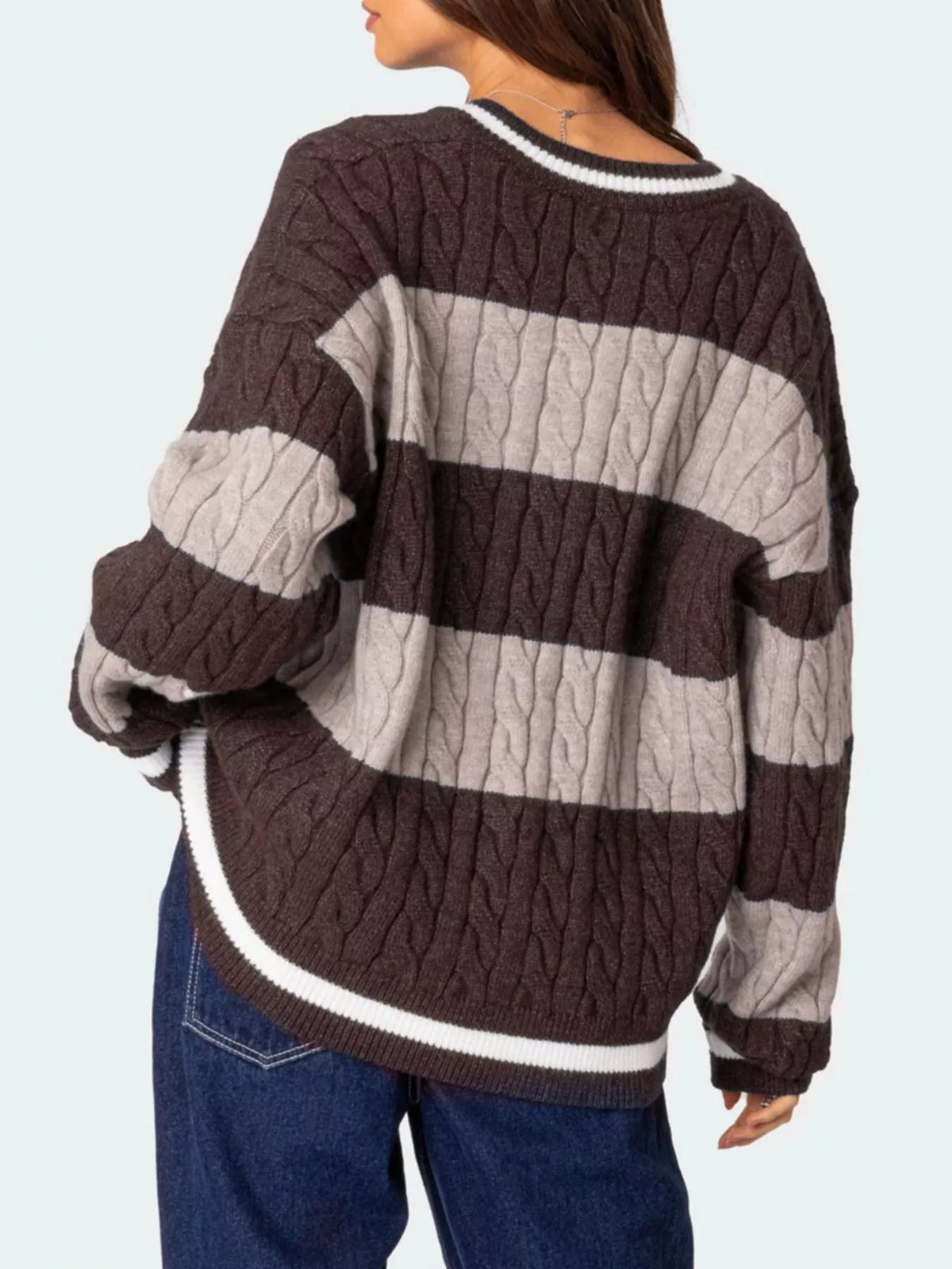 Brown cable knit sweater on model