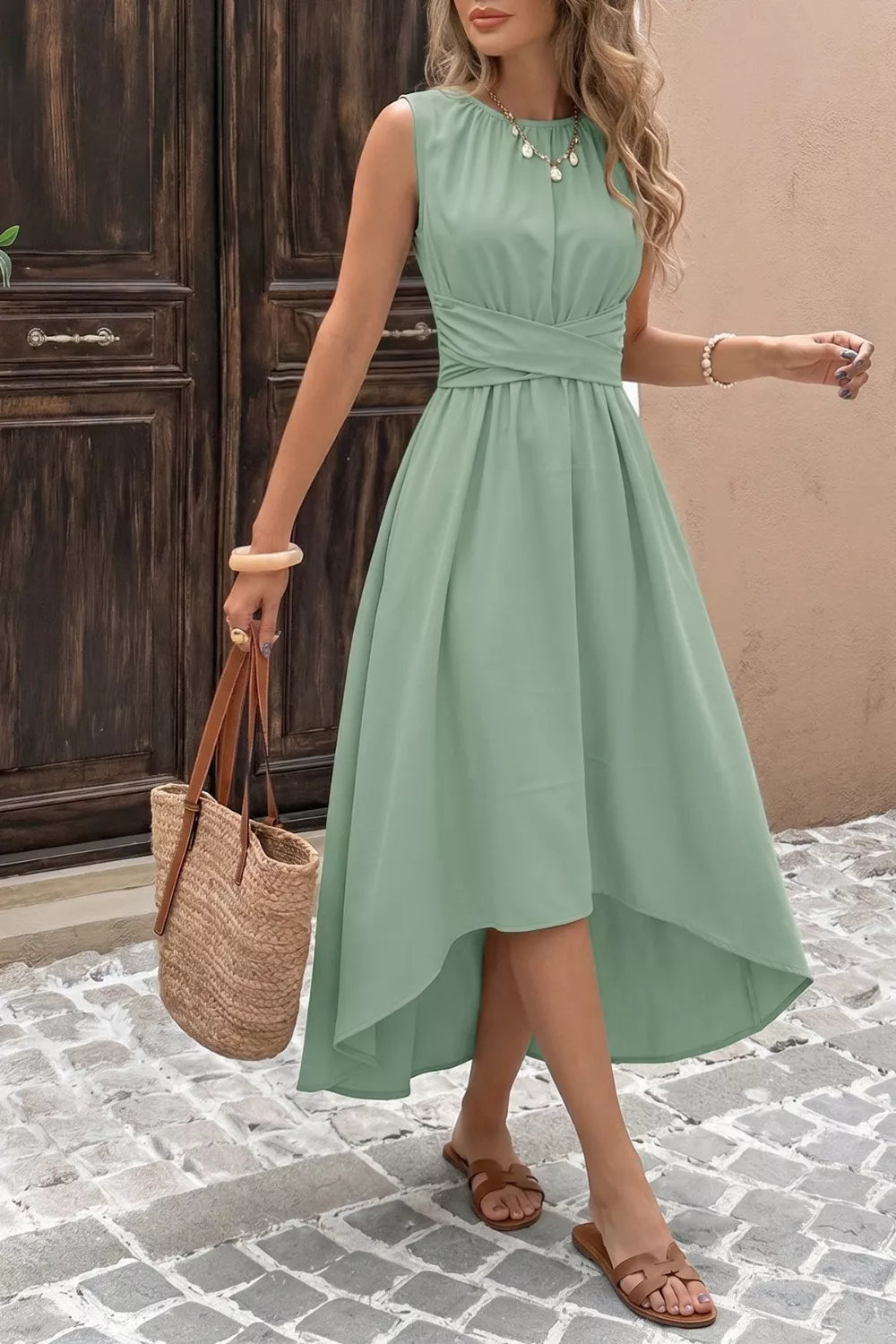 Sage green sleeveless high low hem A line dress front view