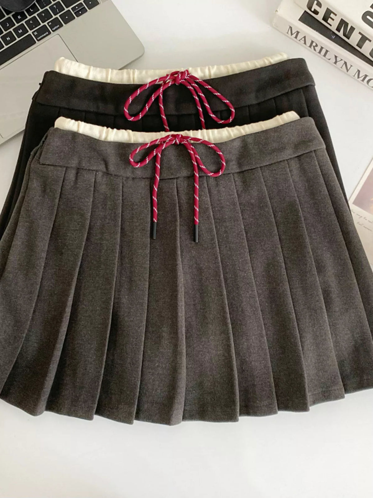 Dark gray pleated mini skirt front view